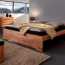 Pluses of a wooden double bed, design features and sizes