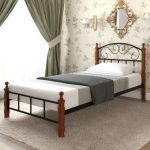 With wrought-iron headboard and back